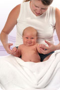 Finding yourself after childbirth: photo of new mother with baby.